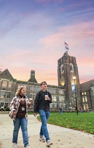 two students walking on college campus